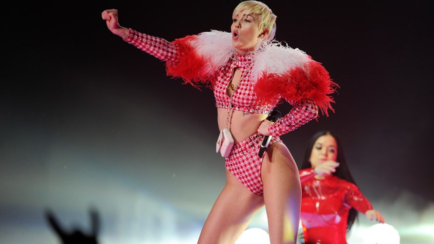 miley cyrus in red in concert ap.jpg